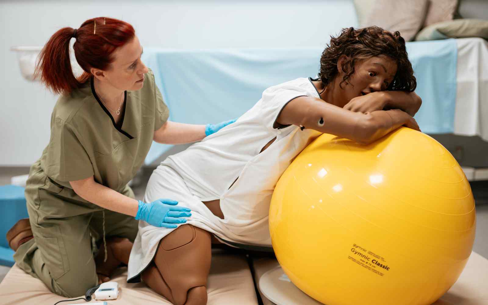 A manaquin with a ball in labour