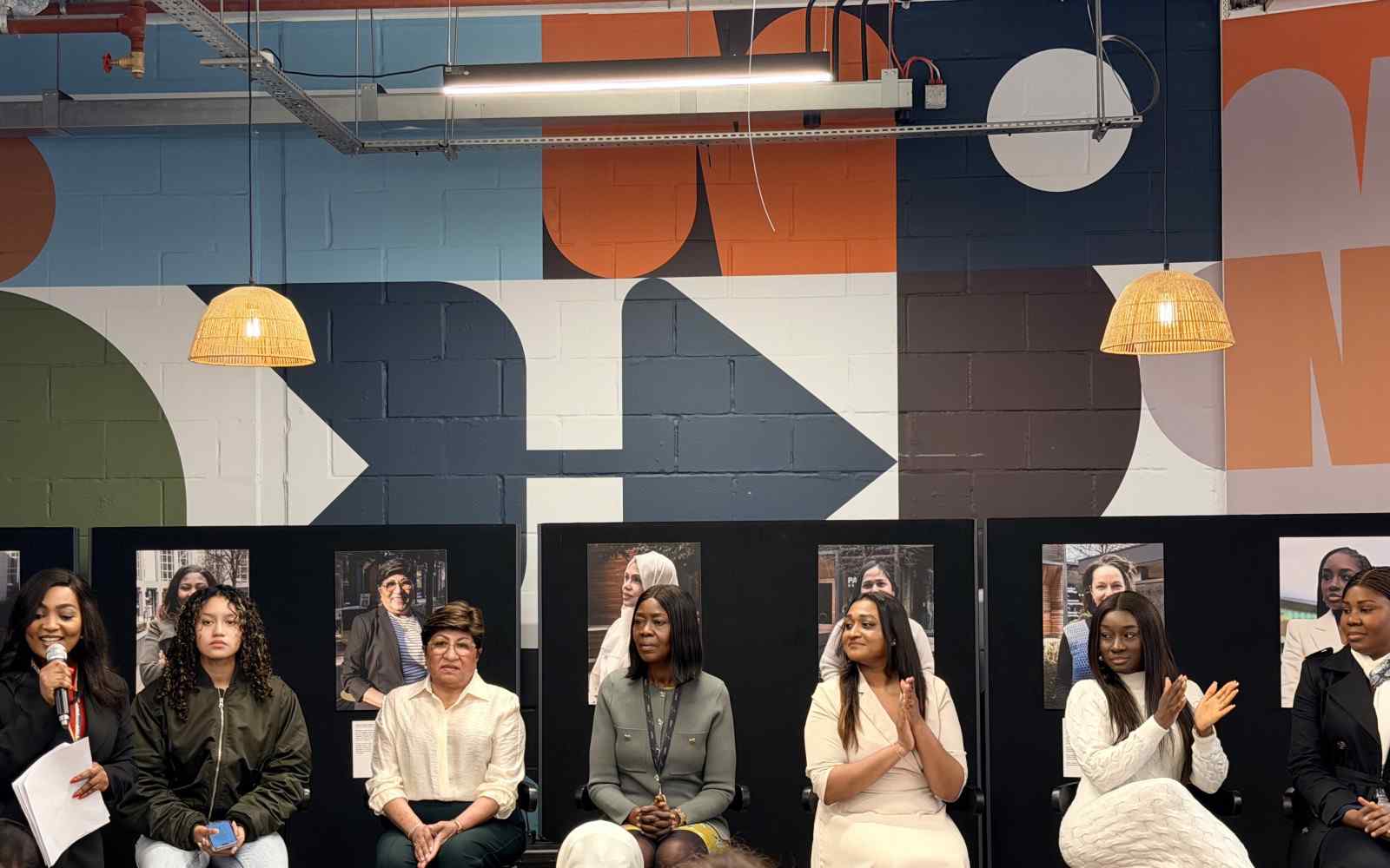 A panel of seven women