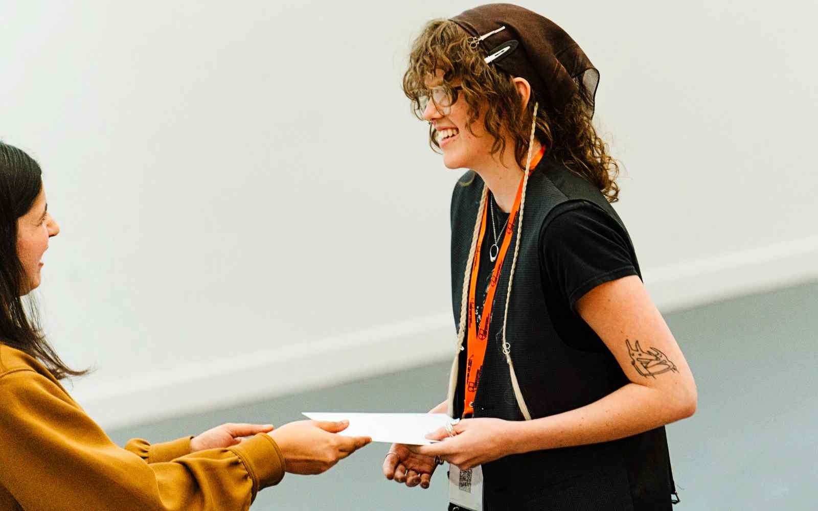 A student being handed an award certificate