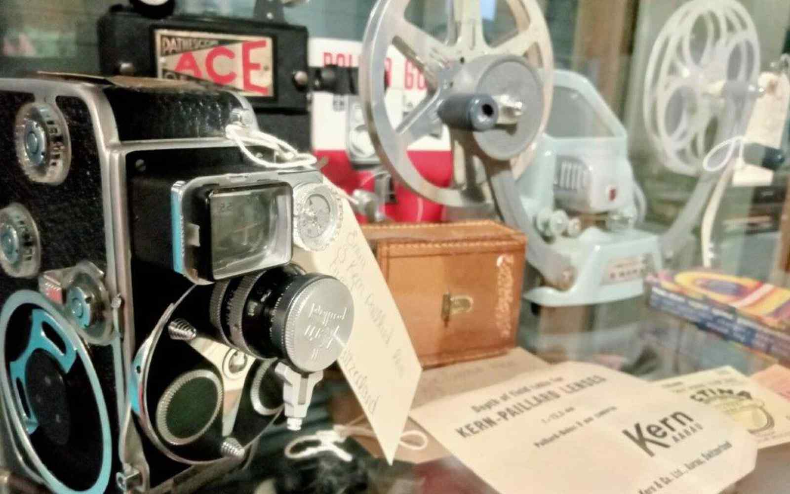 a close up of vintage videography equipment including a camera and tape reels
