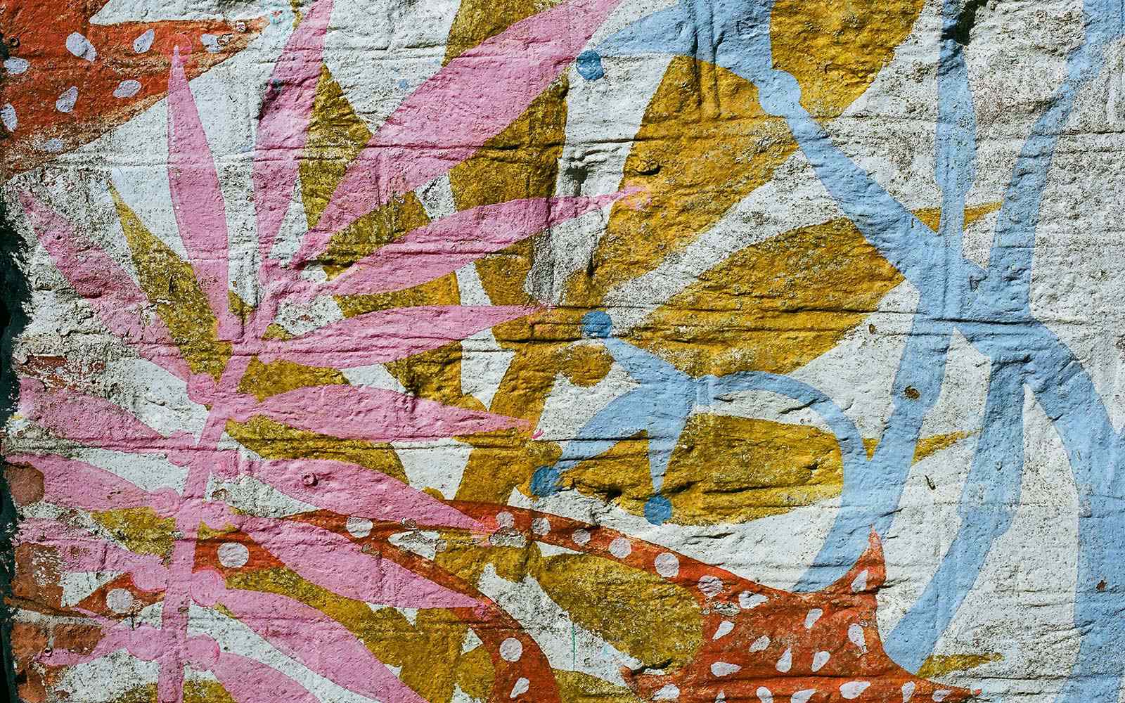 Colorful abstract graffiti art on a brick wall