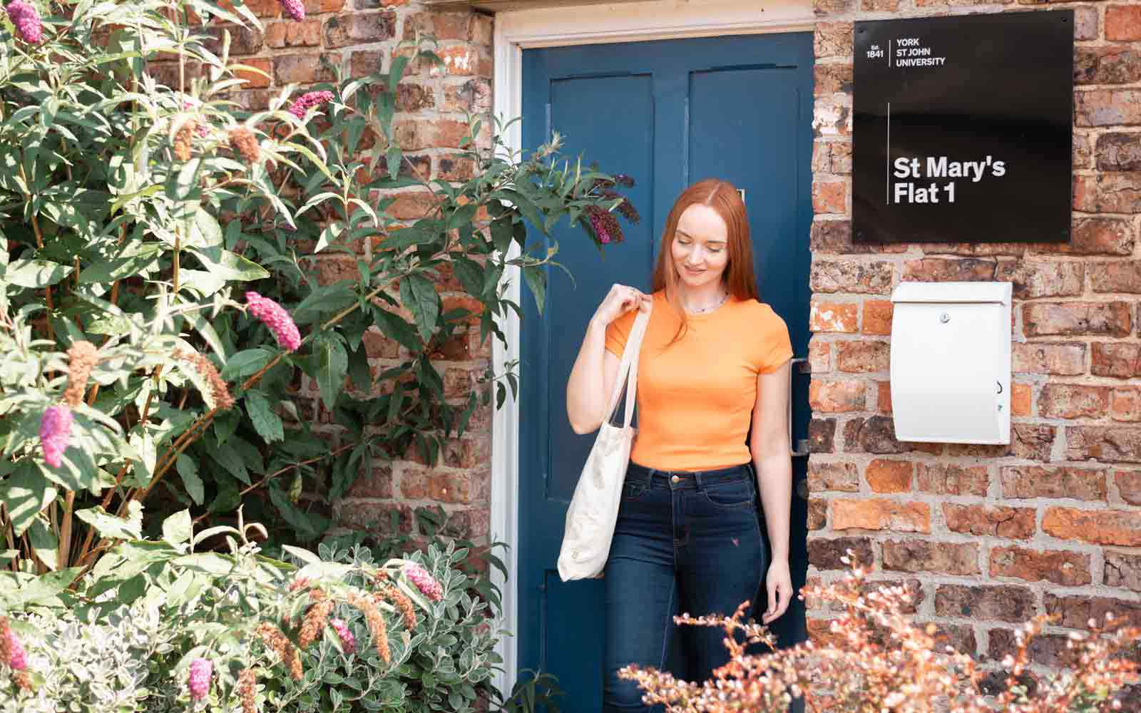 A student standing outside St Mary's flat 1.