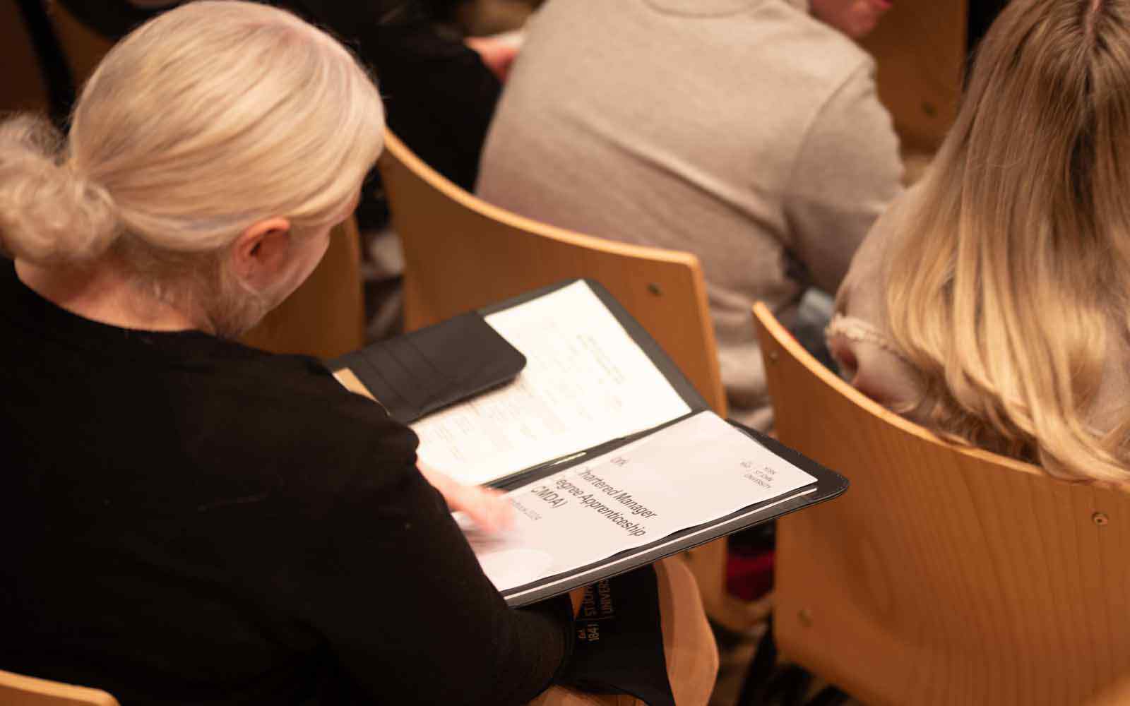 Student in apprenticeship induction talk.