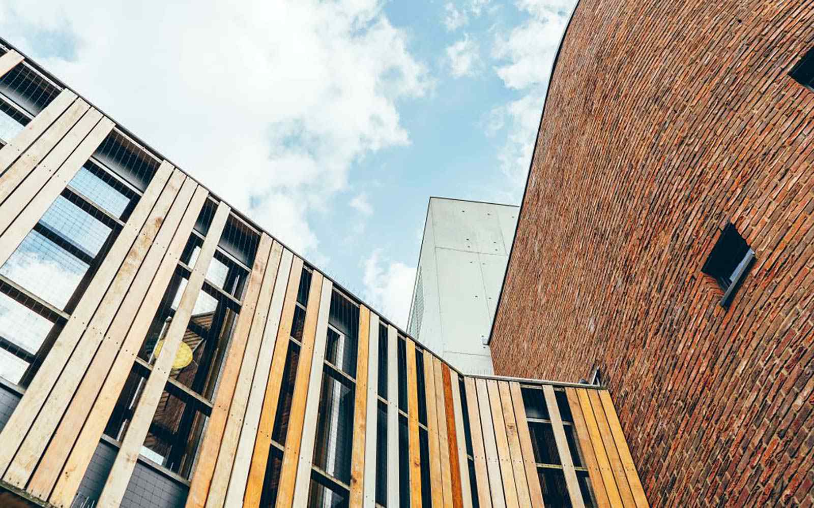 Blue sky and clouds above campus buildings
