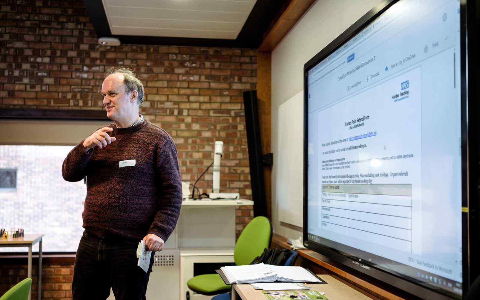 A tutor presenting a class.
