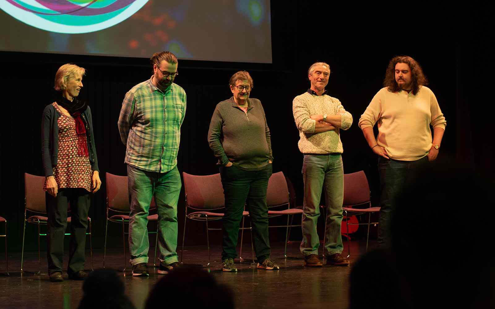 A group of Converge students perform improv comedy on stage
