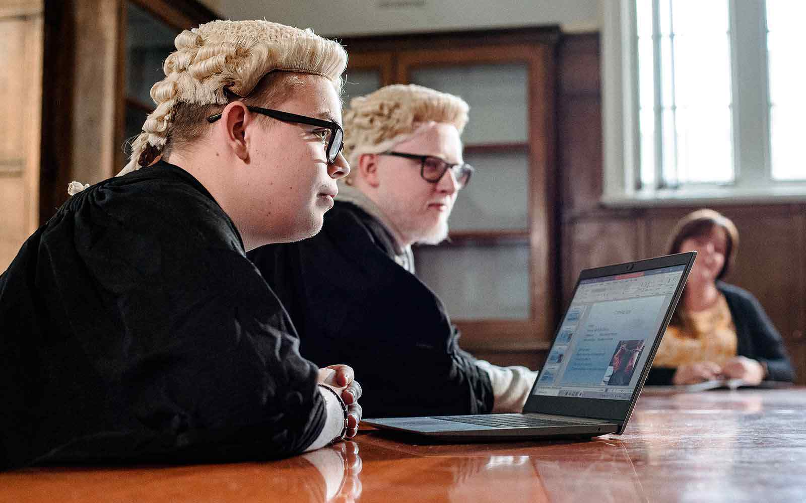 Law students in a mock court setting.
