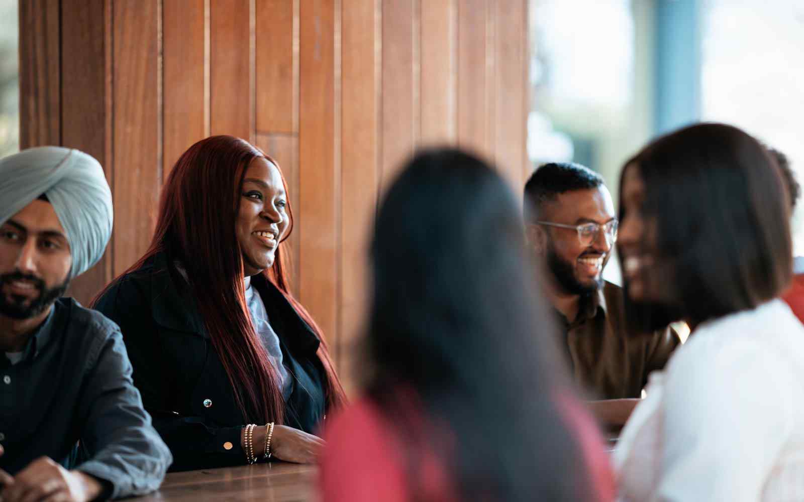 Students sitting together and smiling.