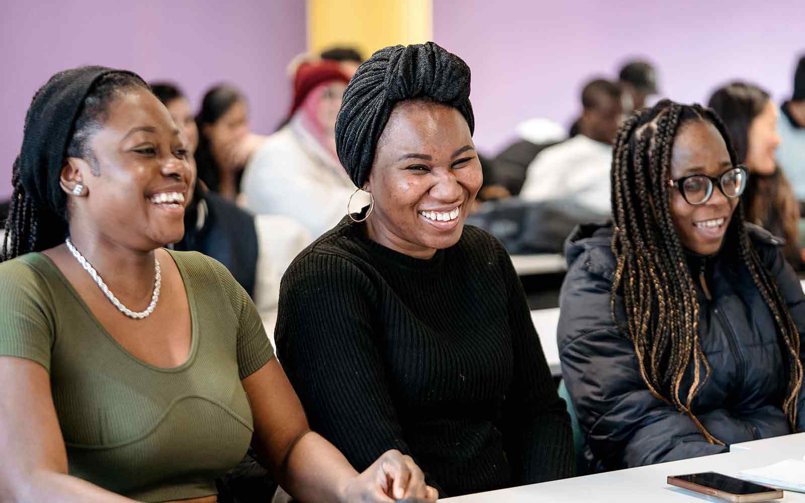 Students talking and laughing in class.