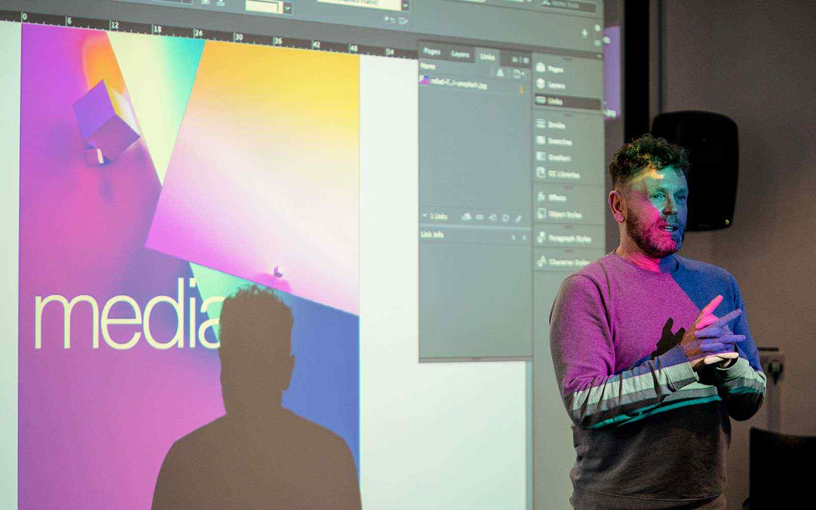 Media lecturer presenting to class.