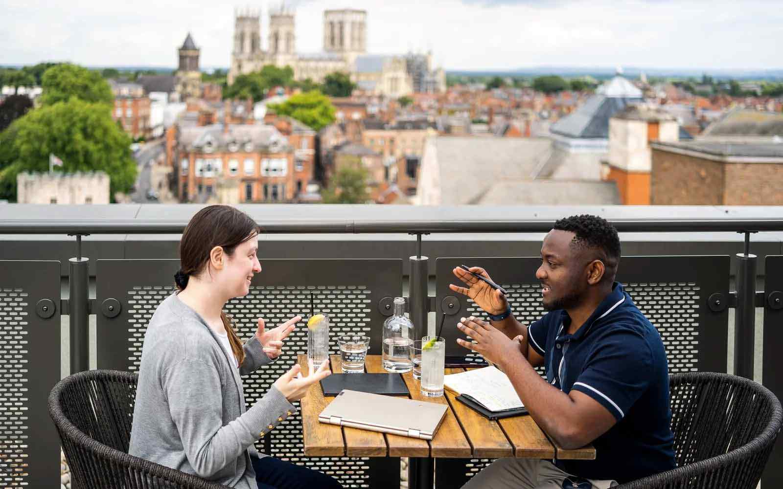 Students studying at the Malmaison with Minster in the background.