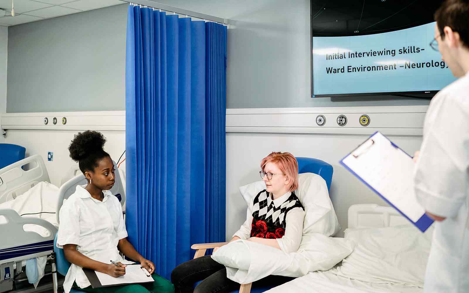 Occupational Therapy students working in a ward.