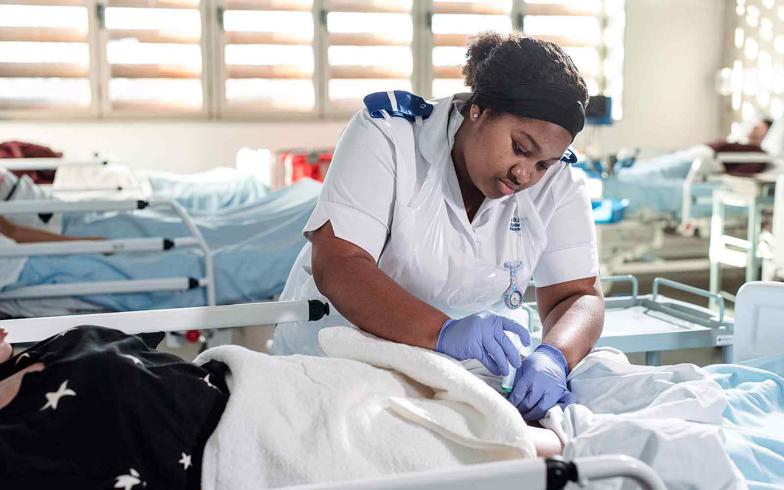 Nursing student in a ward setting.