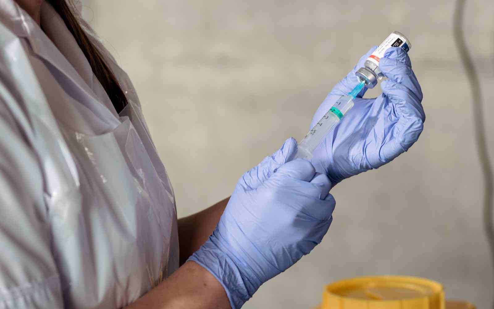 A nurse preparing a vaccine.