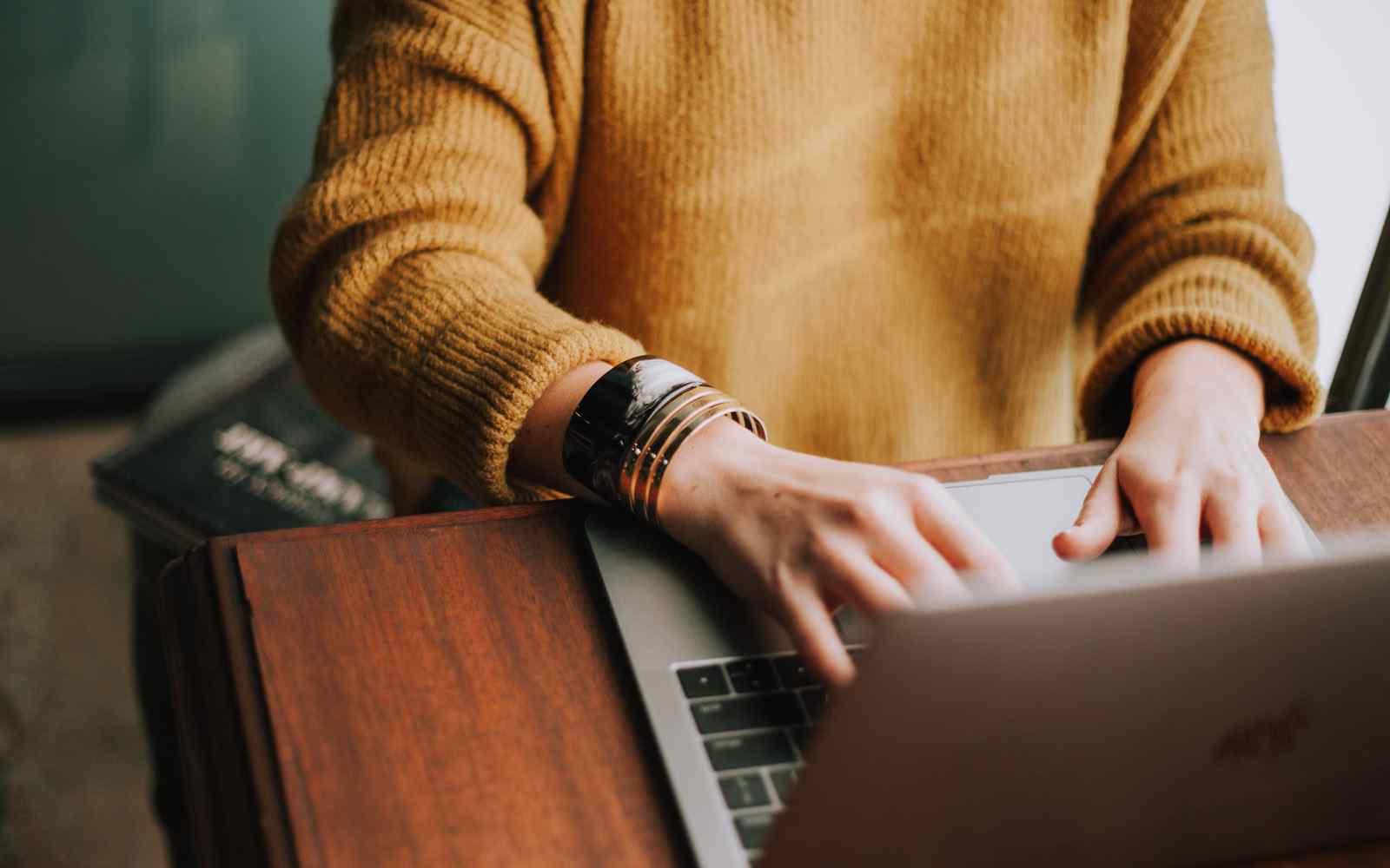 Person working at laptop on desk