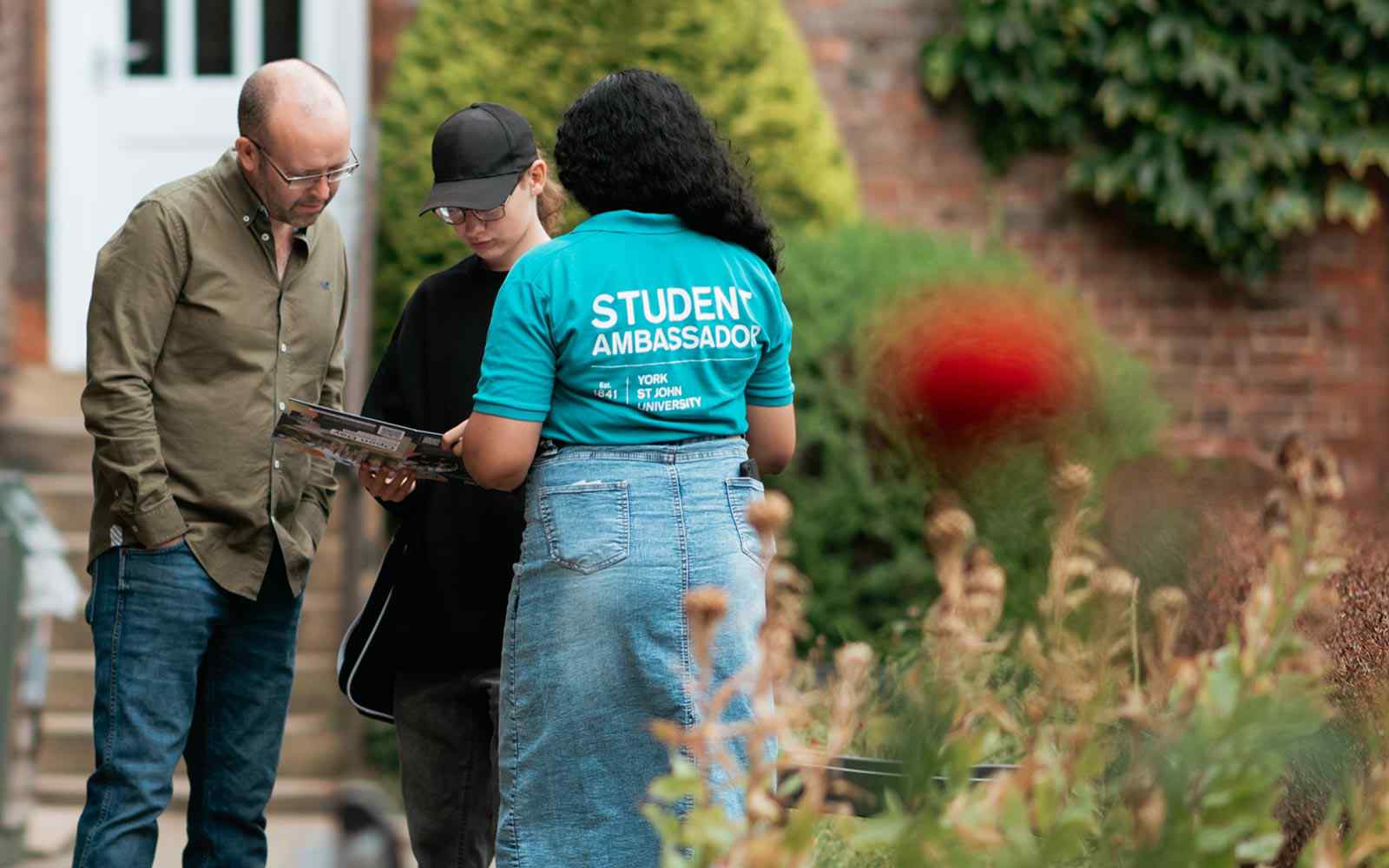 Student Ambassador helping guests find their way at Open Day