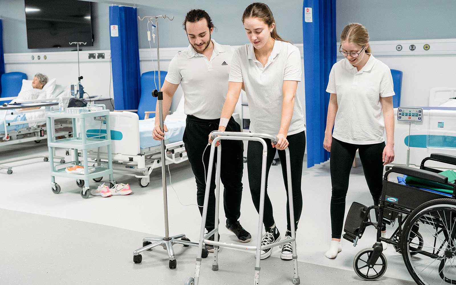 Physiotherapy students in a ward setting.