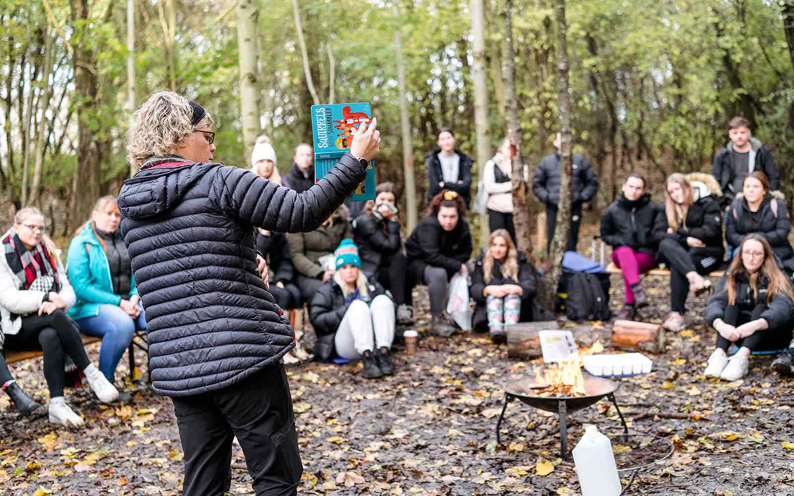 Lecturer leading a forest school session with PGCE students