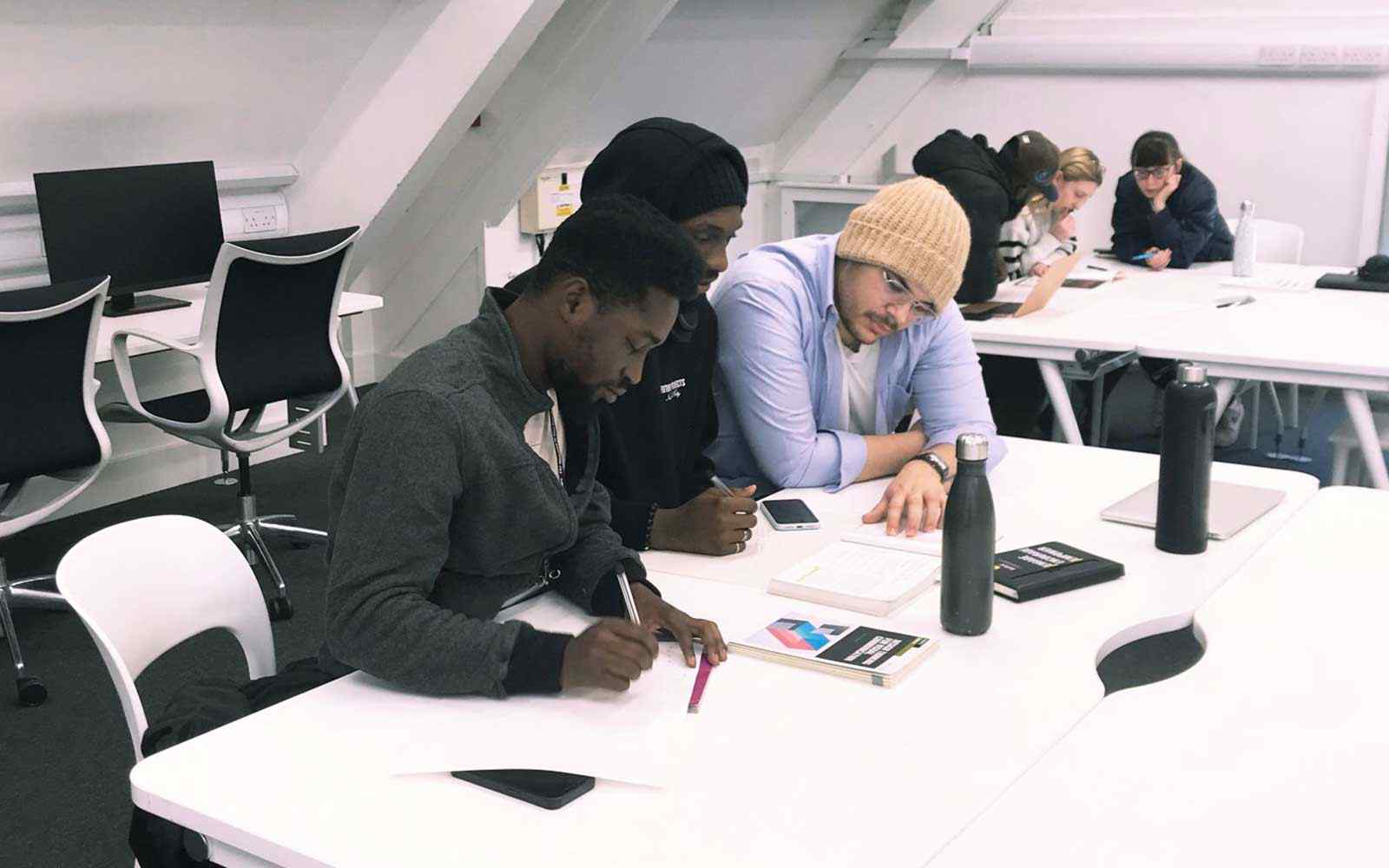 A group of students in a Product Design classroom.