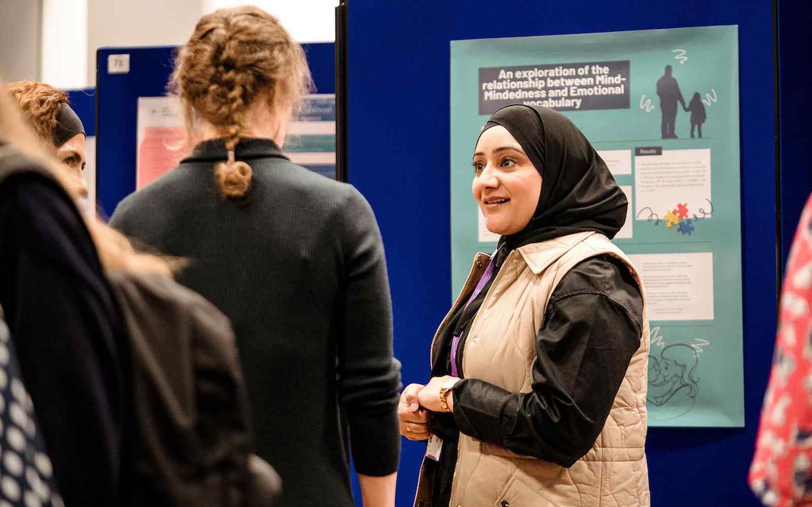 Student in front of poster