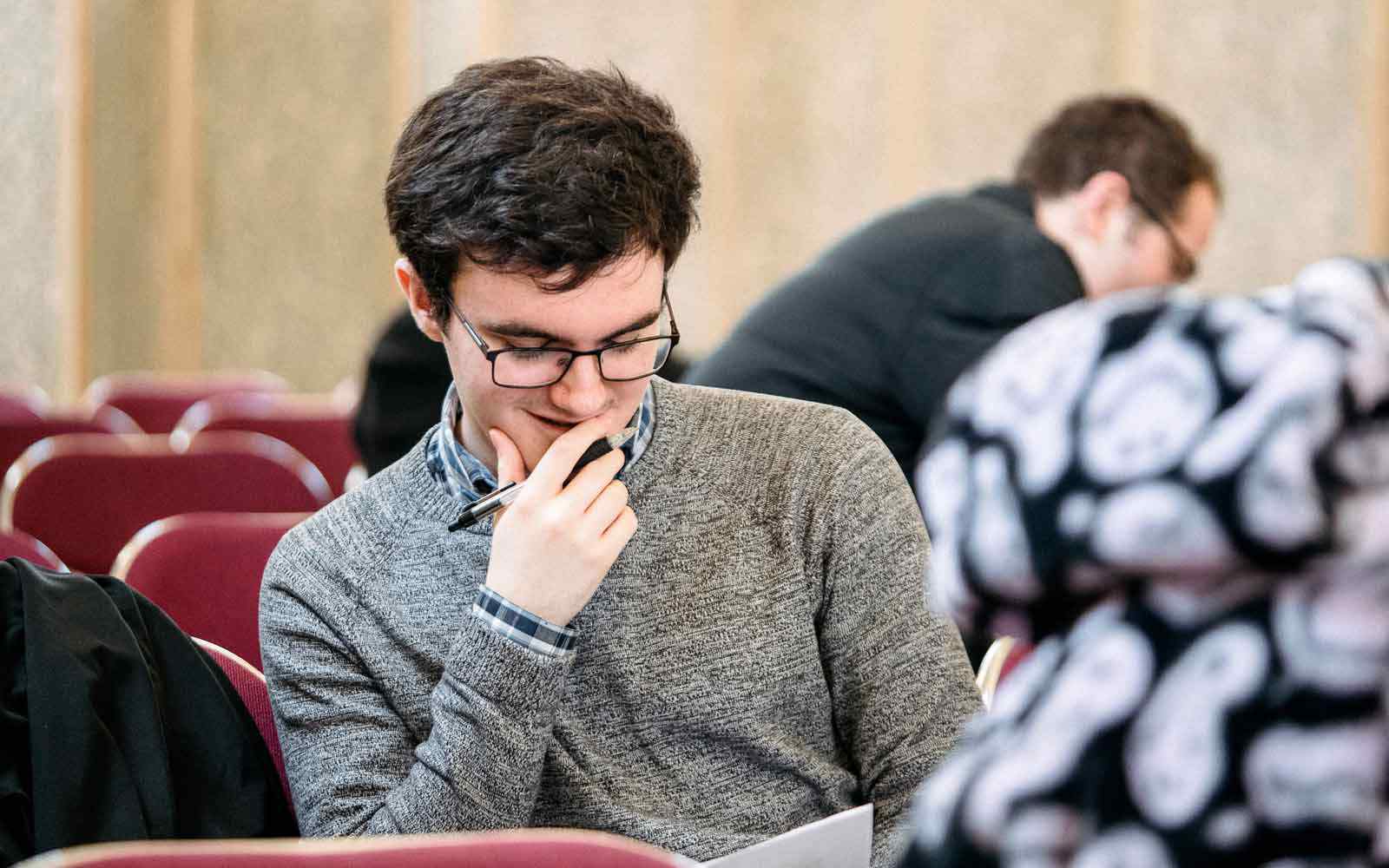 A student reads during class.