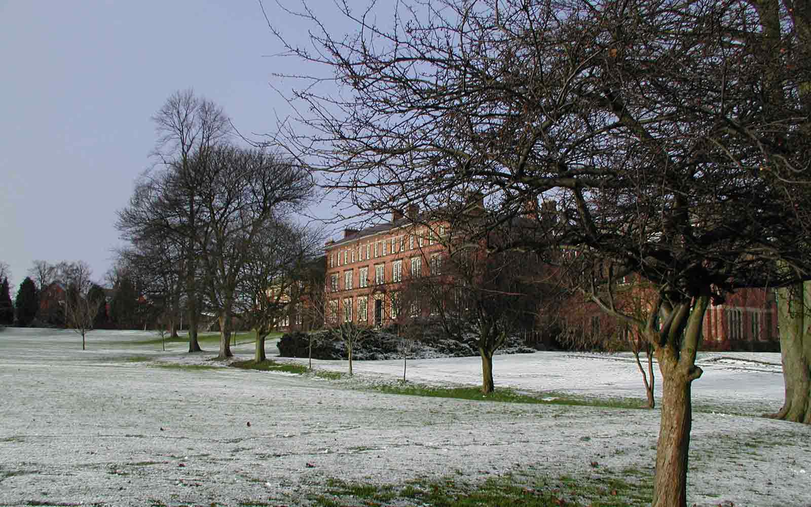 Ripon College surrounded by trees and frost