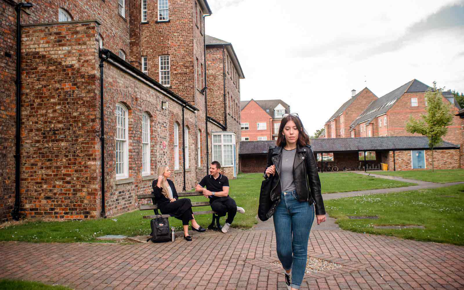 Students walking and chatting at the Grange accommodation.