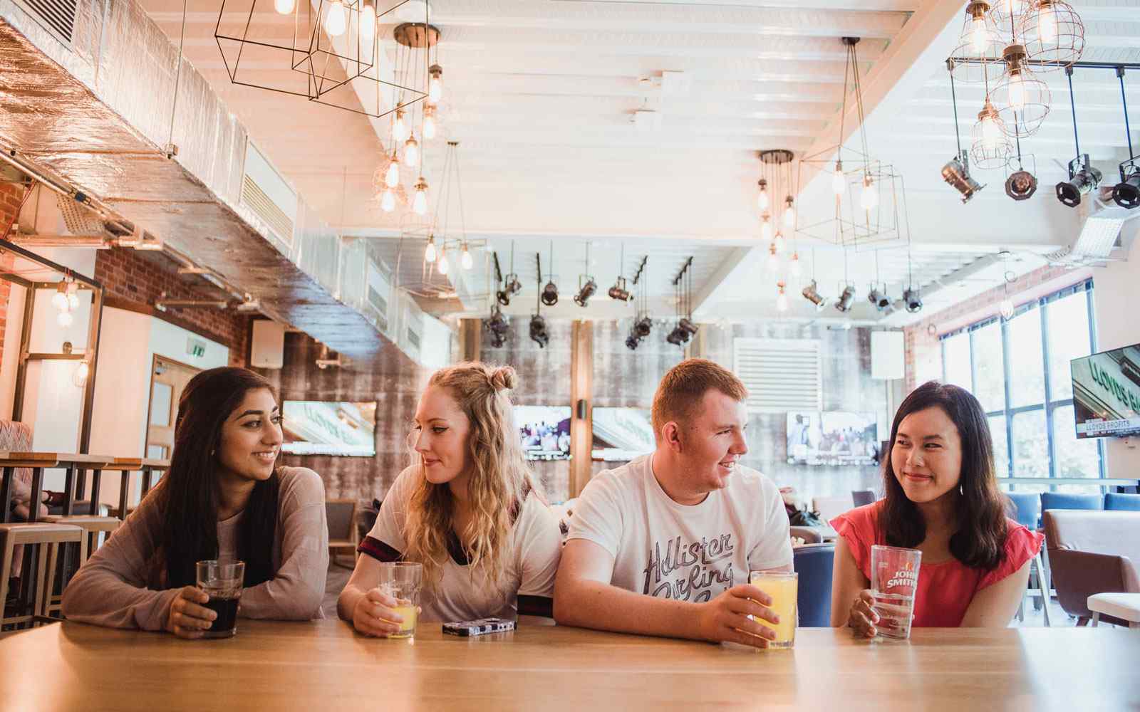 Students chatting in the su