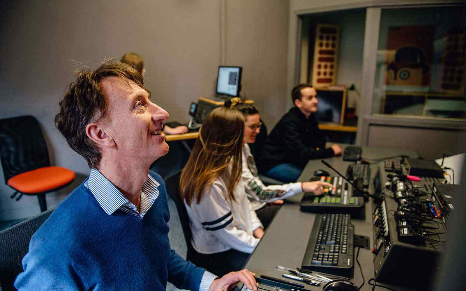 Media production lecturer and students using the equipment