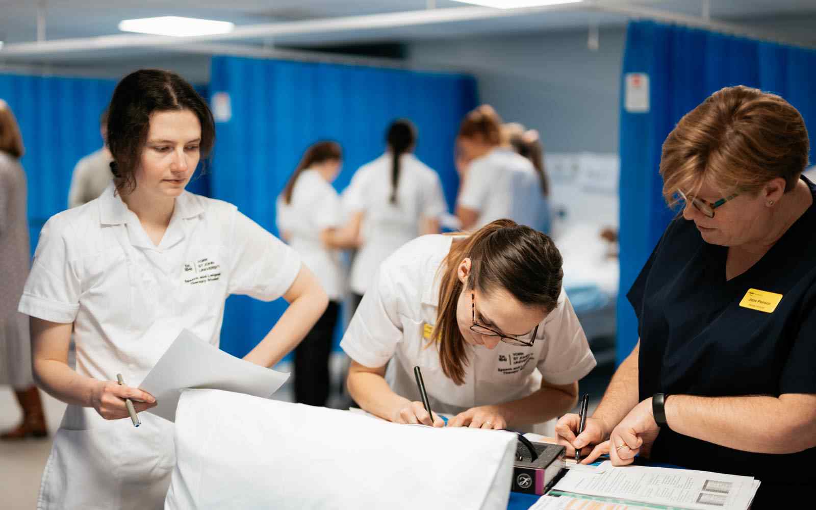 Speech and language therapy students in a ward setting.