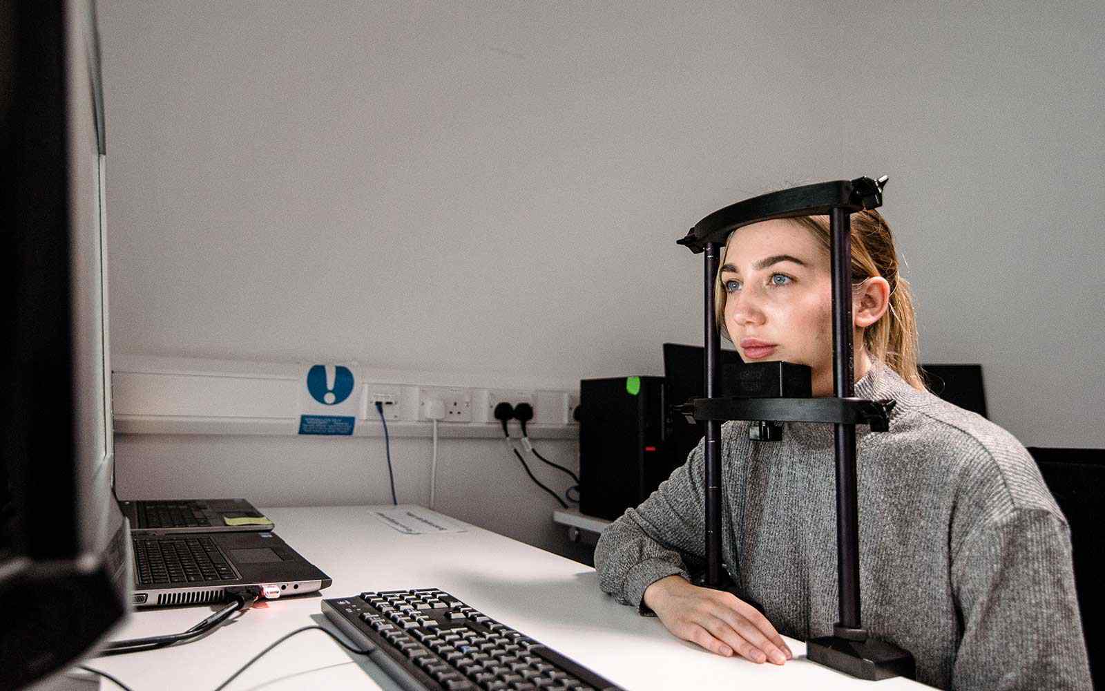 Student using the psychology equipment