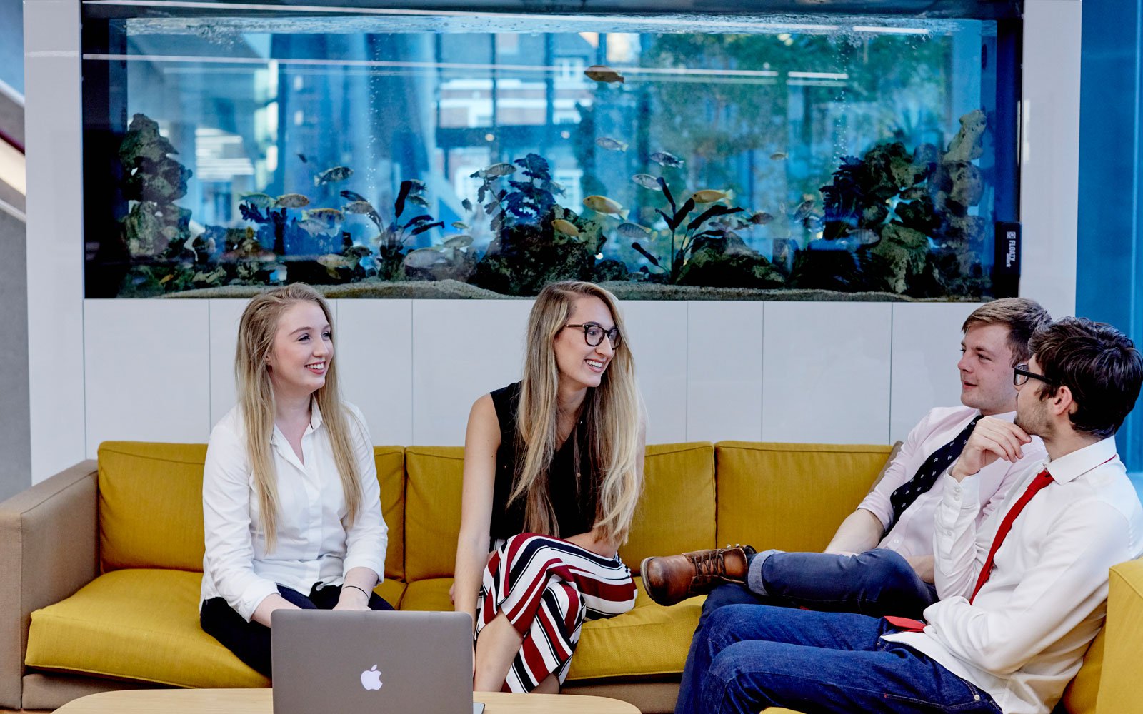 Students sat on a sofa