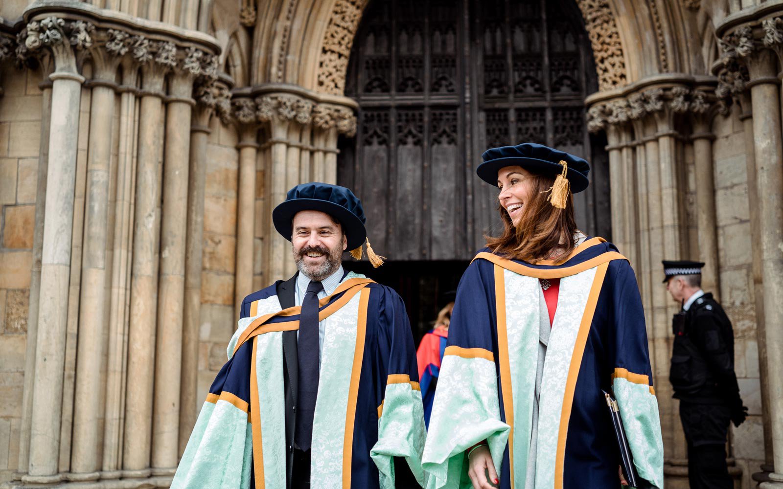 Honorary graduates walking out of the minster