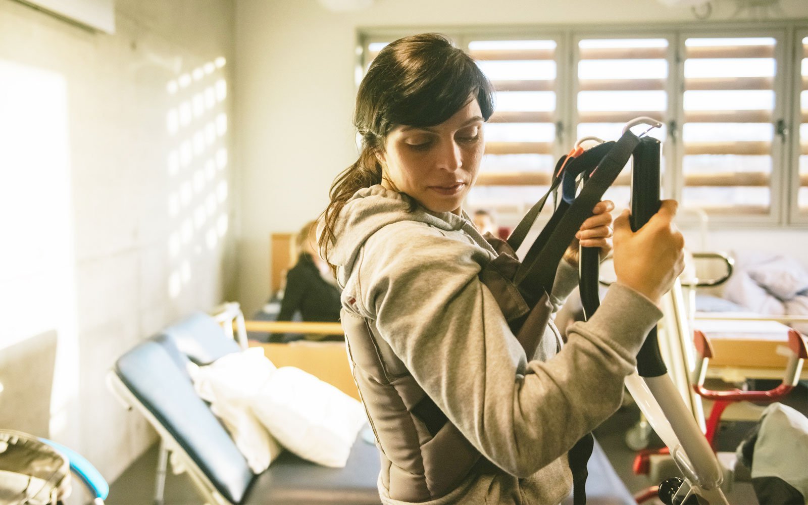 Student in an occupational therapy room using a hoist.