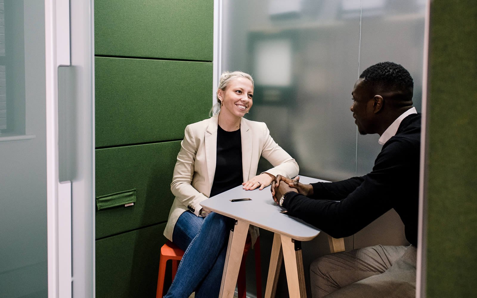 Two students talking in campus space