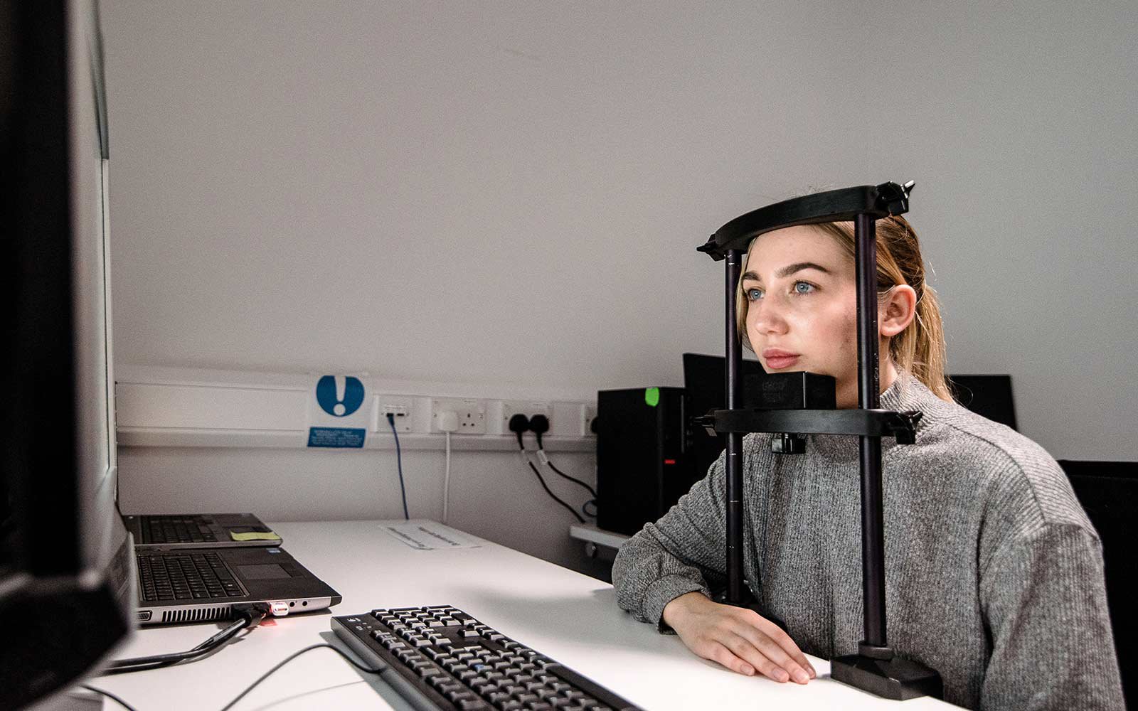 Student using the psychology equipment