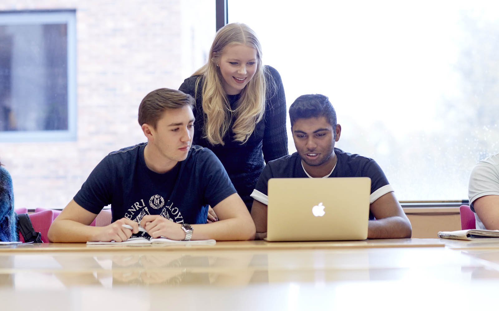 Lecturer helping students