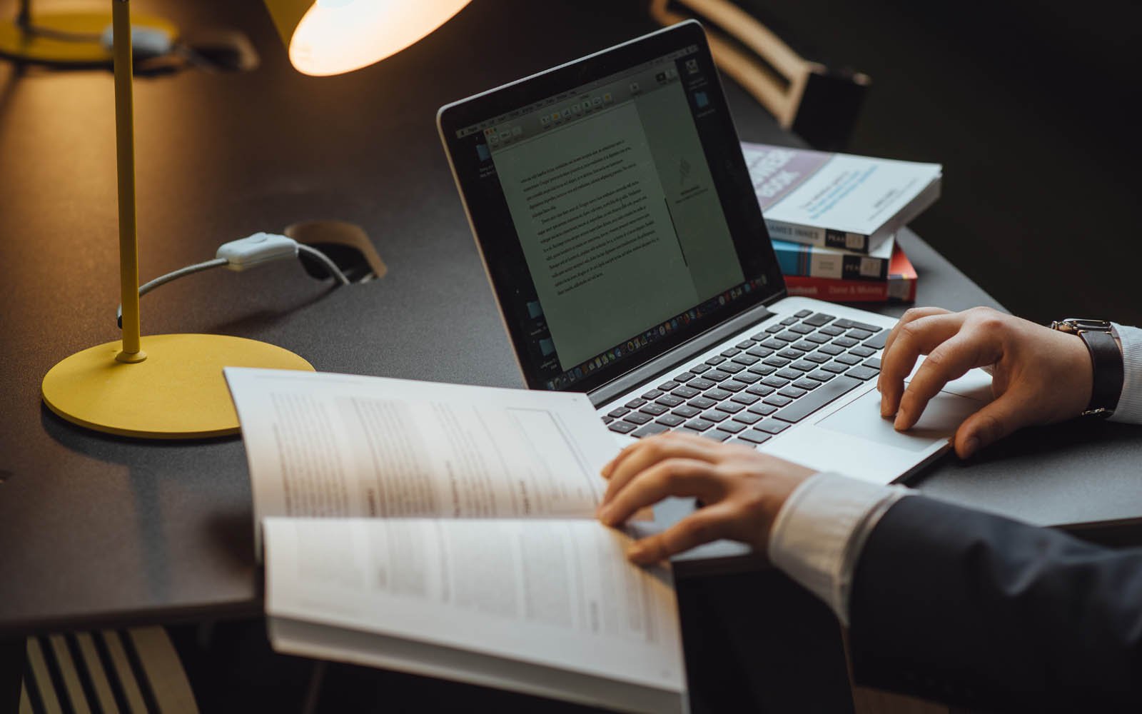 Laptop with hands typing