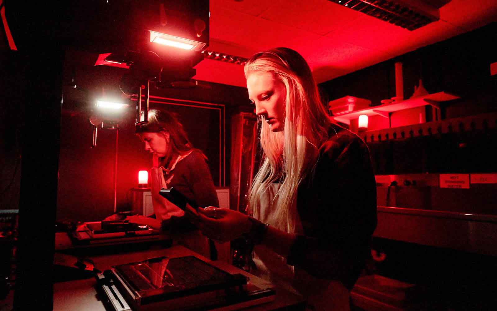 Students in photography dark room