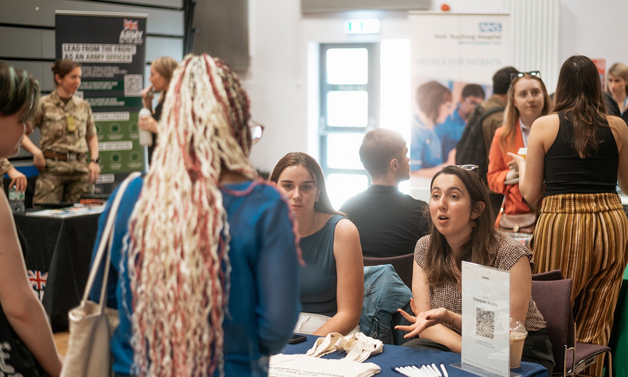 Students at stall at Graduate Careers Fair 