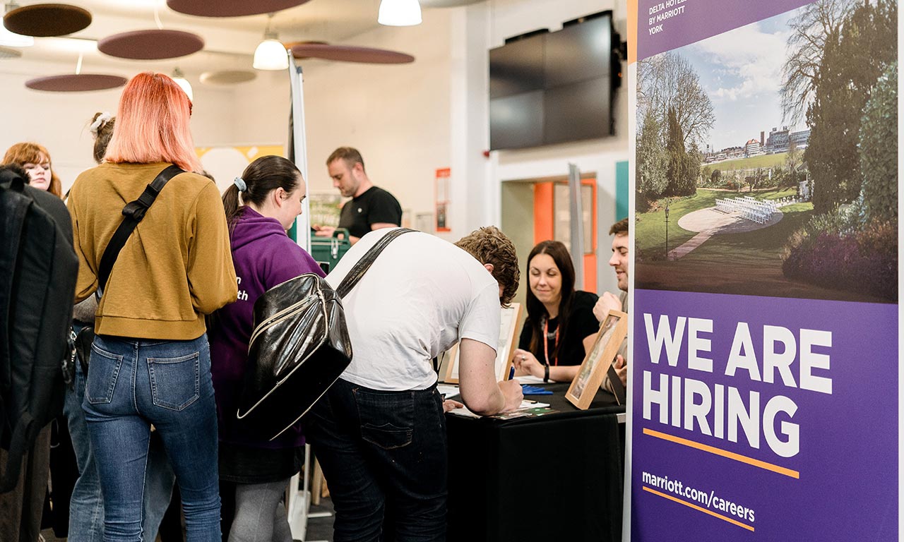 Roller banner saying We are hiring at Jobs Fair 