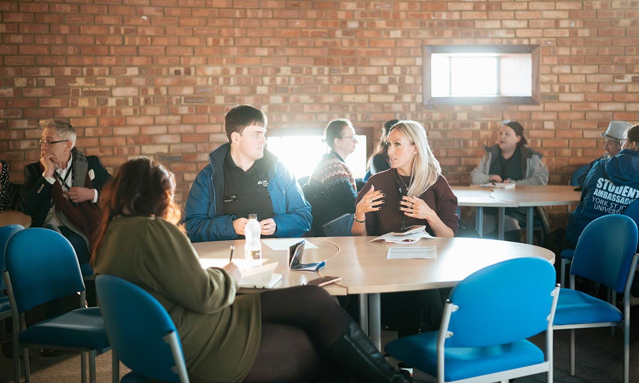 Table of delegates in discussion 