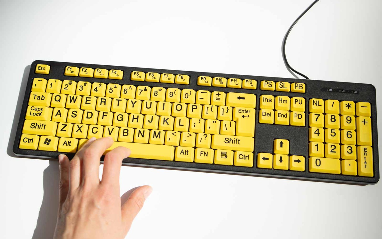 Large print contrast keyboard featuring bright yellow keys. 