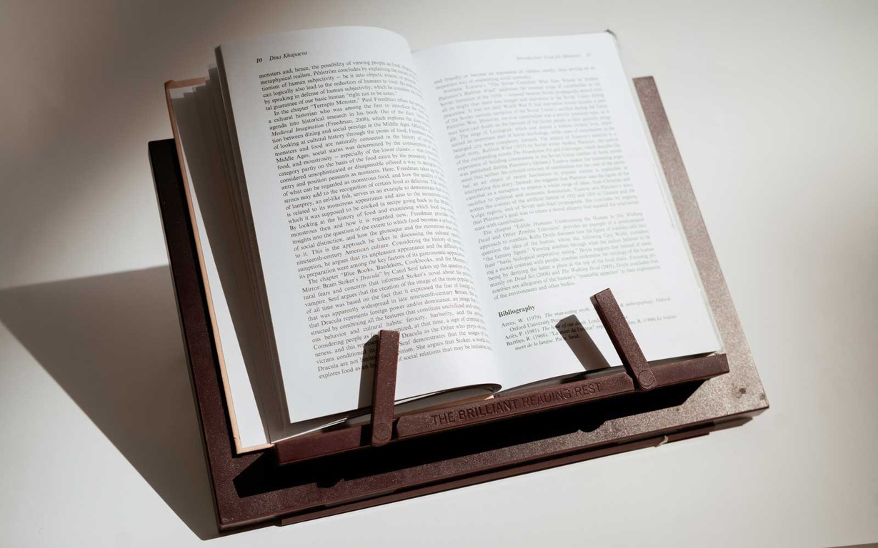 A book open on a book rest. 