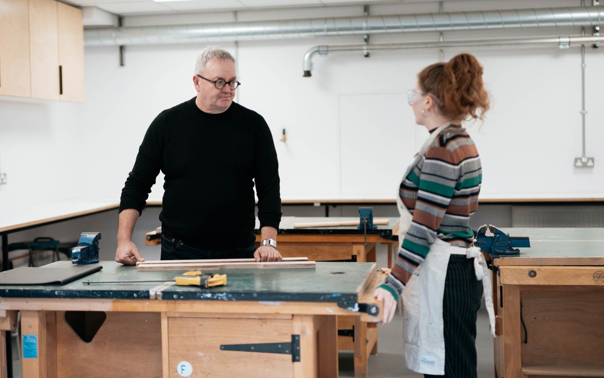 A lecturer and student using a workshop in the Design Centre. 