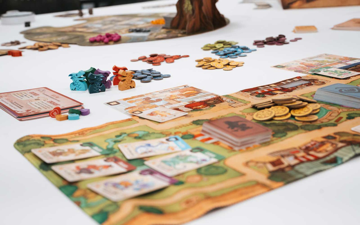 The board, cards, and player pieces for the game Flamecraft. 