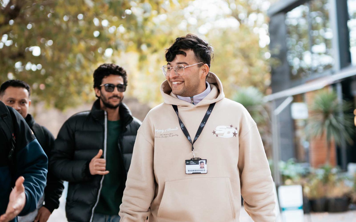 Students walking outside on York St John University London Campus. 