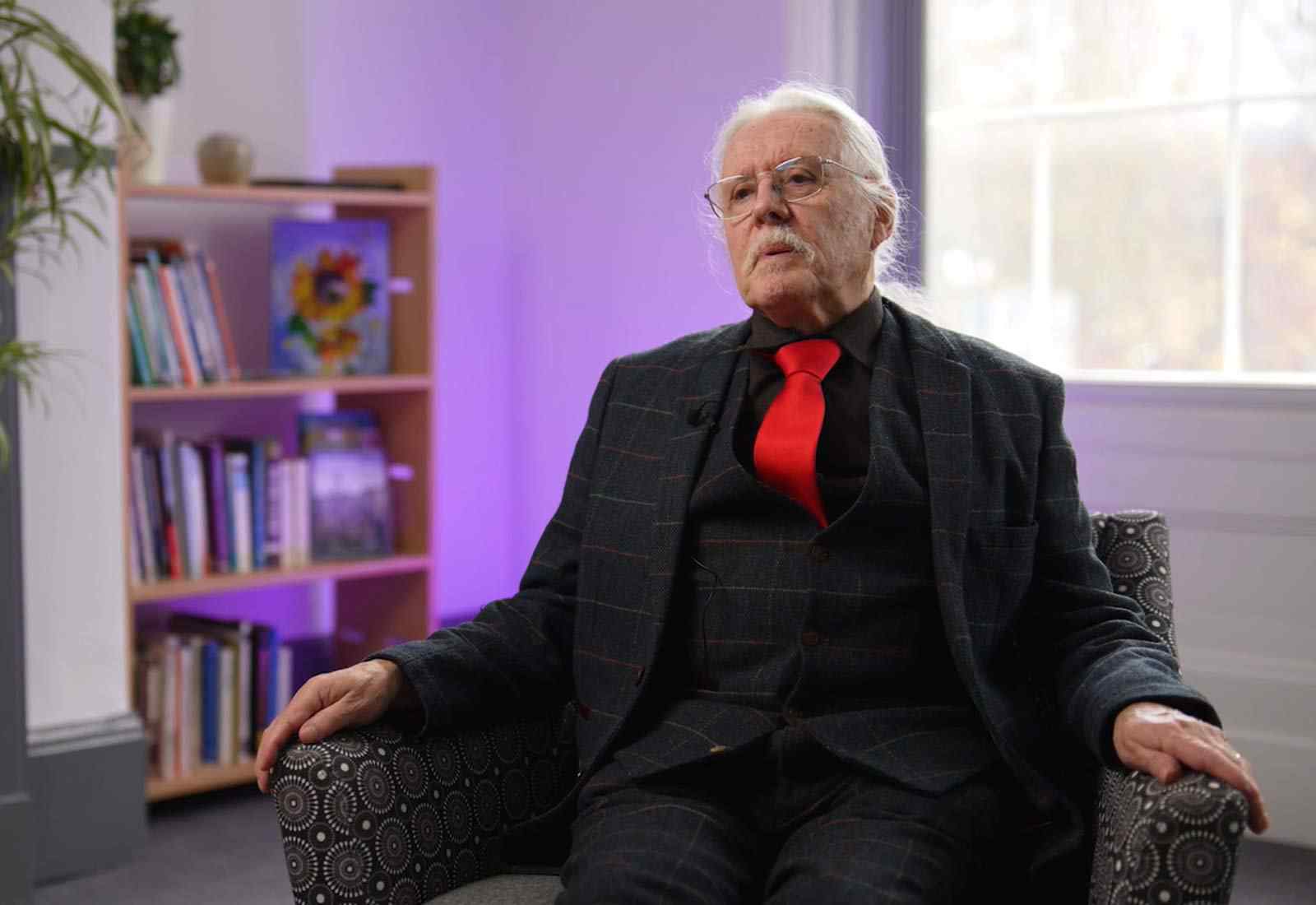 A man sitting in a chair. 