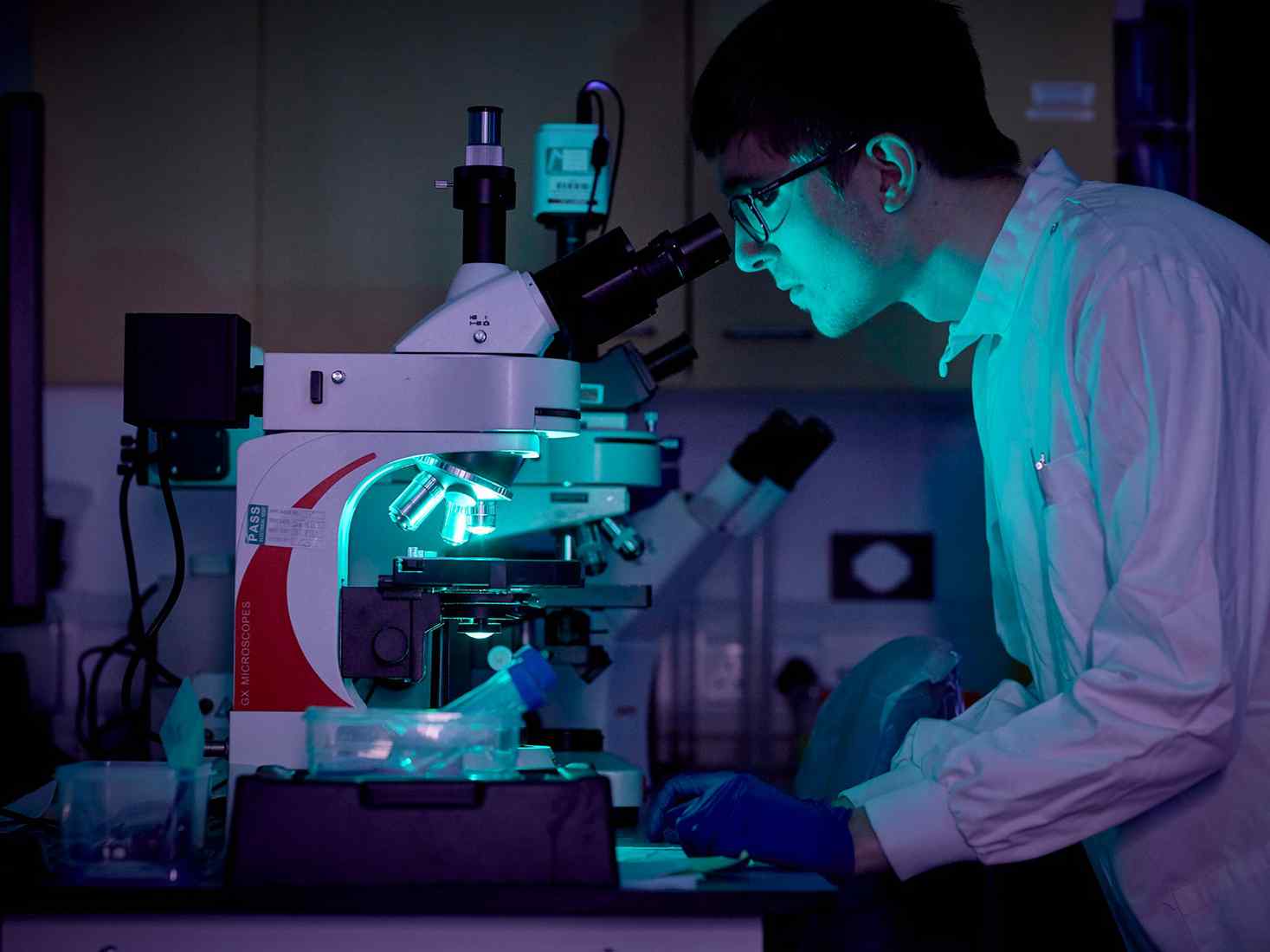 Student looking into a microscope 