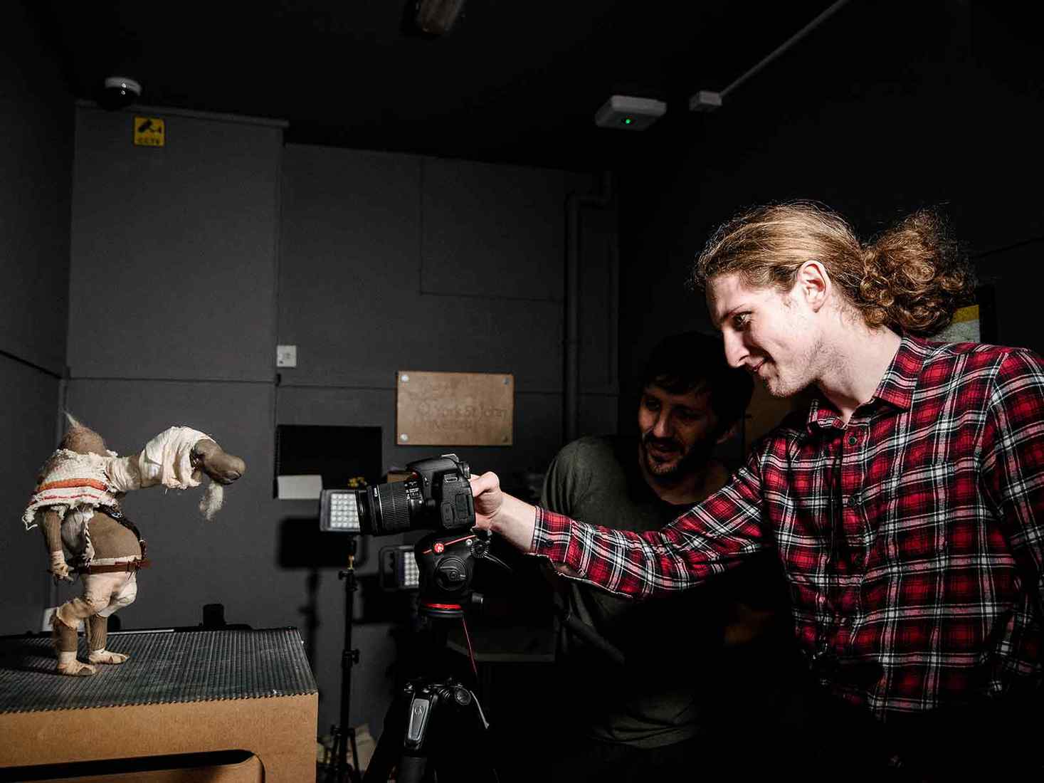 A student films a stop motion scene 